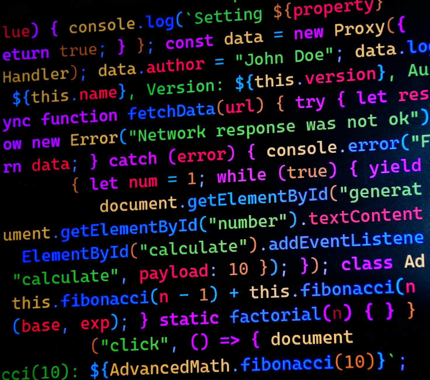 Zbliżenie kolorowego kodu JavaScript na ekranie monitora